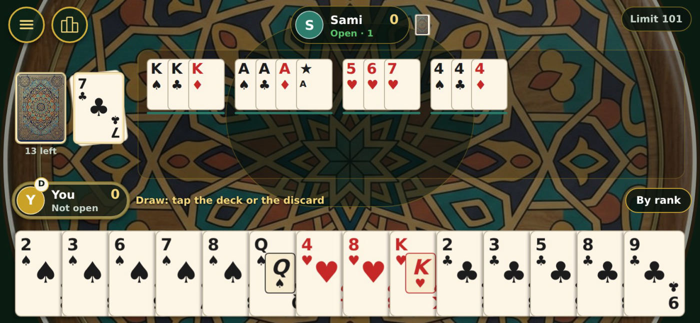14: sets and runs laid down on the table, the deck and the discard pile on the left, and a hand of fourteen cards